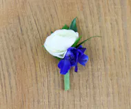 White Ranunculus with Dark Blue Delphinium Boutonniere