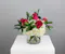 Half dozen roses with white hydrangea is a classic floral arrangement featuring a half dozen roses artfully arranged in a 5x5 clear glass cylinder vase