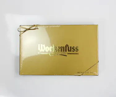 Indulge in a delightful treat with Wockenfuss's 12oz box of assorted milk and dark chocolates.