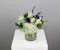 Blue Moon is a serene and enchanting floral arrangement that captures the calm beauty of a moonlit night.