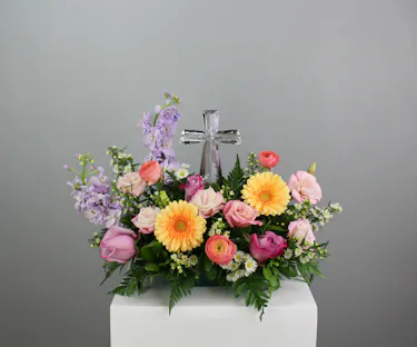 The Everlasting Love sympathy arrangement is a poignant and elegant tribute, designed to convey heartfelt condolences and everlasting memories.