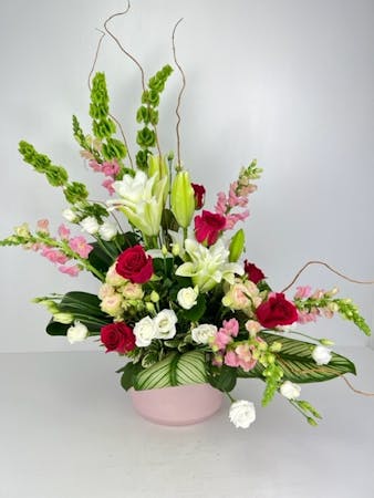 Harmony in Bloom is an exquisite floral arrangement that captures the essence of tranquility and elegance