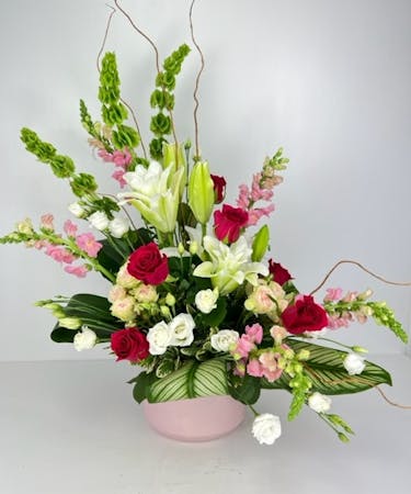 Harmony in Bloom is an exquisite floral arrangement that captures the essence of tranquility and elegance