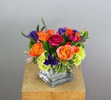 The Alpine Aurora is a breathtaking floral arrangement that captures the vibrant beauty of Colorado's high-altitude landscapes. 