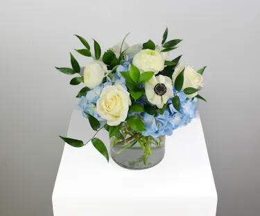 Welcome the sweetest little bundle with Baby Blue — a charming baby boy arrangement designed in soft, serene tones.