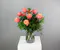 A timeless display of grace and beauty, this arrangement features a dozen exquisite peach Kahala roses showcased in a classic clear glass vase.