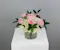 Half dozen roses with white hydrangea is a classic floral arrangement featuring a half dozen roses artfully arranged in a 5x5 clear glass cylinder vase