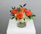 Half dozen roses with white hydrangea is a classic floral arrangement featuring a half dozen roses artfully arranged in a 5x5 clear glass cylinder vase