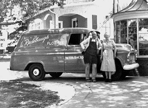 George Radebaugh and wife pose with a delivery van outside the showroom, circa 1940